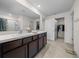 Modern bathroom with a double sink vanity, walk-in closet, and walk-in shower offering both style and functionality at 4806 Sw 86Th Ln, Ocala, FL 34476