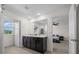 Bright bathroom with a double sink vanity, large mirror, and access to the bedroom and closet at 4806 Sw 86Th Ln, Ocala, FL 34476