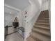 Entryway with staircase, tiled floors, and a coat rack at 4806 Sw 86Th Ln, Ocala, FL 34476