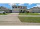 A beautiful two-story home with a well-maintained lawn, showcasing an attached two-car garage and inviting curb appeal at 4806 Sw 86Th Ln, Ocala, FL 34476