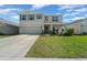 Inviting two-story home with a spacious driveway and beautifully landscaped front yard at 4806 Sw 86Th Ln, Ocala, FL 34476