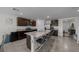 Well-appointed kitchen featuring a central island with bar seating, stainless steel appliances, and granite countertops at 4806 Sw 86Th Ln, Ocala, FL 34476