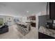 Open concept kitchen and living area with a large island, stainless steel appliances, and tile flooring at 4806 Sw 86Th Ln, Ocala, FL 34476