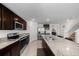 Open kitchen with granite countertops, stainless steel appliances, and access to the living areas at 4806 Sw 86Th Ln, Ocala, FL 34476
