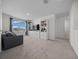 Spacious living room with a comfortable sofa, built-in shelving, and plenty of natural light at 4806 Sw 86Th Ln, Ocala, FL 34476