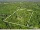 Explore this secluded property surrounded by dense woodland, defined by precise boundary lines at 6577 Nw 193Rd St, Micanopy, FL 32667