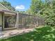 Backyard with a screened-in pool and covered patio, offering an inviting outdoor space at 6577 Nw 193Rd St, Micanopy, FL 32667