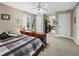Bedroom with a bed featuring a striped blanket and a view of an office space at 6577 Nw 193Rd St, Micanopy, FL 32667