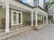 Covered patio with multiple seating areas and direct access to the screen enclosed pool at 6577 Nw 193Rd St, Micanopy, FL 32667