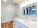 Bright bathroom featuring a marble countertop and modern fixtures at 7787 Nw 56Th Pl, Ocala, FL 34482