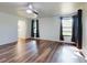 Bedroom featuring wood floors, neutral paint, a ceiling fan, and natural light at 7787 Nw 56Th Pl, Ocala, FL 34482