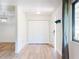 Bright foyer with wood floors, a closet, and neutral paint at 7787 Nw 56Th Pl, Ocala, FL 34482