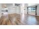 Open-concept living room with hardwood floors and modern lighting at 7787 Nw 56Th Pl, Ocala, FL 34482