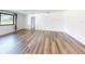 Bright living room featuring hardwood floors and a large window at 7787 Nw 56Th Pl, Ocala, FL 34482