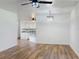 Open-concept living room with hardwood floors and modern lighting at 7787 Nw 56Th Pl, Ocala, FL 34482