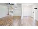 Open-concept living room with hardwood floors and modern lighting at 7787 Nw 56Th Pl, Ocala, FL 34482