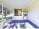 Screened porch featuring carpet, and a view of the spacious backyard at 7787 Nw 56Th Pl, Ocala, FL 34482