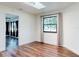 Bright sunroom with wood flooring, a skylight and large windows at 7787 Nw 56Th Pl, Ocala, FL 34482