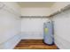 Organized walk-in closet with shelving and a water heater at 7787 Nw 56Th Pl, Ocala, FL 34482