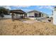 Backyard area featuring a gazebo, gravel landscaping, and a privacy fence at 882 Tanglewood Pl, The Villages, FL 32162