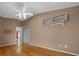 Bedroom featuring wood flooring, a ceiling fan and closet at 882 Tanglewood Pl, The Villages, FL 32162