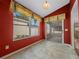 A dining area with an adjacent screened-in porch, perfect for enjoying a meal at 882 Tanglewood Pl, The Villages, FL 32162