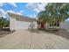 Charming one-story home with a well-maintained lawn and a two-car garage at 882 Tanglewood Pl, The Villages, FL 32162