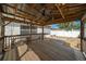 Covered gazebo featuring a ceiling fan, wooden railings, and access to the backyard at 882 Tanglewood Pl, The Villages, FL 32162