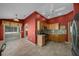 Kitchen with light wood cabinets, stainless appliances, and easy access to the screened in porch at 882 Tanglewood Pl, The Villages, FL 32162