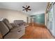 Comfortable living room with a ceiling fan and sliding glass doors at 882 Tanglewood Pl, The Villages, FL 32162