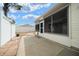 Enclosed patio features white vinyl siding and screened windows, offering an outdoor living space at 882 Tanglewood Pl, The Villages, FL 32162
