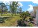 Lush backyard space with mature trees and meticulous landscaping for enjoying outdoor living at 9728 Sw 95Th Loop, Ocala, FL 34481