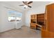 Bedroom with carpet flooring, desk and chair, ceiling fan and a window at 9728 Sw 95Th Loop, Ocala, FL 34481