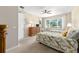 Inviting bedroom with two twin beds, dresser, and a large window with outdoor views at 9728 Sw 95Th Loop, Ocala, FL 34481
