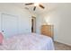 Comfortable bedroom with a ceiling fan and carpet flooring at 9728 Sw 95Th Loop, Ocala, FL 34481