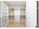 Spacious walk-in closet with built in shelving, drawers, and hanging racks at 9728 Sw 95Th Loop, Ocala, FL 34481