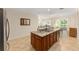 Modern kitchen with granite island, stainless steel appliances, and open concept design at 9728 Sw 95Th Loop, Ocala, FL 34481