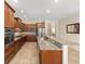 Lovely kitchen featuring granite counters, stainless appliances, and ample counter space for cooking at 9728 Sw 95Th Loop, Ocala, FL 34481