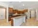 Well-appointed kitchen with dark wood cabinets, granite counters, and stainless steel appliances at 9728 Sw 95Th Loop, Ocala, FL 34481