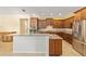 Gourmet kitchen featuring an island, stainless steel appliances, and ample countertop space at 9728 Sw 95Th Loop, Ocala, FL 34481