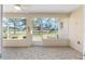 Screened lanai with lovely backyard views, ceiling fan and stone flooring, perfect for outdoor relaxation at 9728 Sw 95Th Loop, Ocala, FL 34481