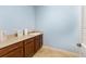 Laundry room features counter, storage, and a light blue painted wall at 9728 Sw 95Th Loop, Ocala, FL 34481
