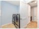 Large laundry room equipped with washer and dryer units, with storage at 9728 Sw 95Th Loop, Ocala, FL 34481