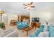 Open living space with sofas and a view of the kitchen and dining area at 9728 Sw 95Th Loop, Ocala, FL 34481