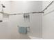 Shower features tiled walls with decorative accent and built in toiletries at 9728 Sw 95Th Loop, Ocala, FL 34481