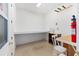 Bright workshop with work bench, storage shelving, and ample lighting at 9728 Sw 95Th Loop, Ocala, FL 34481