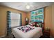 Cozy bedroom with natural light, comfortable bed, and charming decor at 16751 Se 84Th Colerain Cir, The Villages, FL 32162