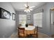 Cozy dining area featuring a round table, four chairs, and natural light from the window at 16751 Se 84Th Colerain Cir, The Villages, FL 32162