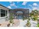 Beautiful backyard showcases a screened pool area with adjacent landscaping and a patio, perfect for outdoor living at 10293 Sw 96Th Ln, Ocala, FL 34481