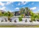 Beautifully landscaped backyard features white rock, lush landscaping, and a screened pool enclosure, offering a private outdoor space at 10293 Sw 96Th Ln, Ocala, FL 34481